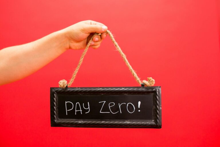a person holding a hanging signage