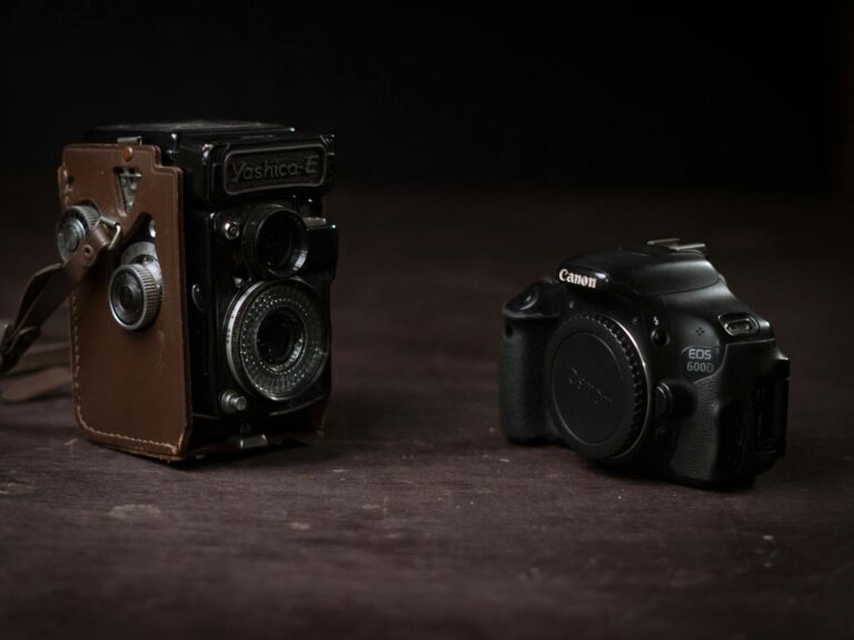 vintage yashica and modern canon camera side by side